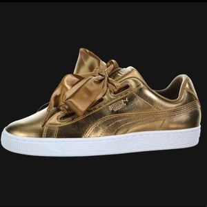 Gold puma sneakers
